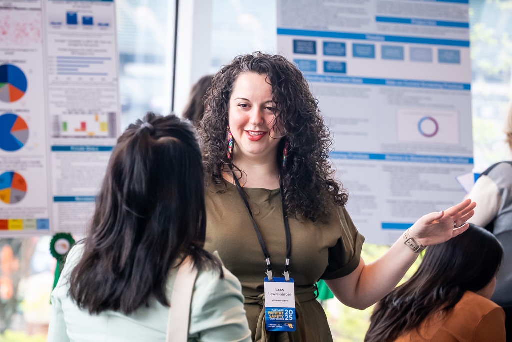 Conference attendee chatting with another attendee